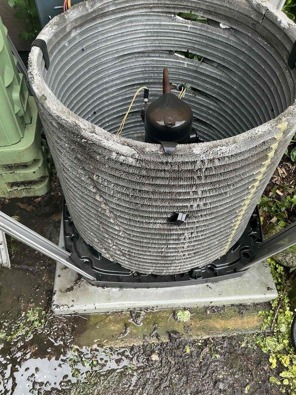 Completed comprehensive air conditioning tune-up on residential split system. Outdoor condenser unit exhibited heavy accumulation of dust, debris, and contamination on coil fins, significantly restricting airflow and reducing heat transfer efficiency. Thoroughly cleaned condenser coils to restore proper airflow and system performance. Inspected compressor and refrigerant lines, confirming proper operation and connections. Additionally performed dryer vent cleaning service, removing substantial buildup of lint and debris from ductwork interior. System tested and verified operational upon completion.