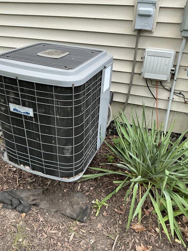 Conducted comprehensive site evaluation for complete HVAC system replacement at residential property. Assessed existing outdoor condensing unit positioned against exterior wall with associated electrical infrastructure including disconnect box and weatherproof receptacle. Inspected attic-mounted air handler, ductwork system including main supply trunk and flexible branch lines, refrigerant piping with visible condensation indicating active operation, and overall system configuration. Documented current equipment conditions, electrical connections, and installation accessibility. Photographed existing equipment and infrastructure to support replacement system design and proposal development.