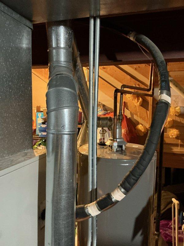 Conducted comprehensive site evaluation for complete HVAC system replacement at residential property. Assessed existing outdoor condensing unit positioned against exterior wall with associated electrical infrastructure including disconnect box and weatherproof receptacle. Inspected attic-mounted air handler, ductwork system including main supply trunk and flexible branch lines, refrigerant piping with visible condensation indicating active operation, and overall system configuration. Documented current equipment conditions, electrical connections, and installation accessibility. Photographed existing equipment and infrastructure to support replacement system design and proposal development.