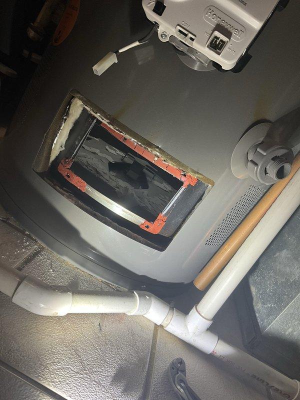 Responded to no hot water complaint at 26-year-old residence. Upon inspection, diagnosed failed heating element in tanked water heater. Removed and replaced defective heating element assembly. Tested unit operation, verified proper ignition sequence, and confirmed restoration of hot water supply throughout home. System returned to normal operating condition.