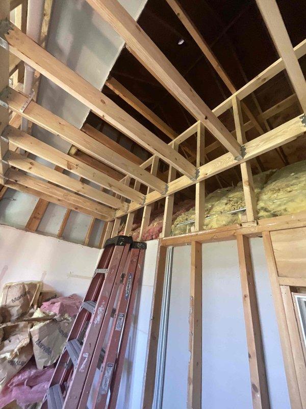 Completed HVAC estimate for mini split installation in bedroom area currently under construction. Assessed exposed ceiling joists, wall framing, and insulation configuration to determine optimal equipment placement and refrigerant line routing. Documented existing conditions including partial drywall installation and structural layout to provide accurate scope of work for ductless heat pump system installation.