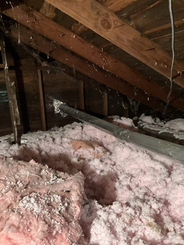 Replaced existing dryer venting system with new rigid piping running through the attic space and installed a new exterior wall termination vent. All necessary parts were available on the service vehicle, allowing for immediate completion of the repair to restore proper dryer exhaust ventilation.