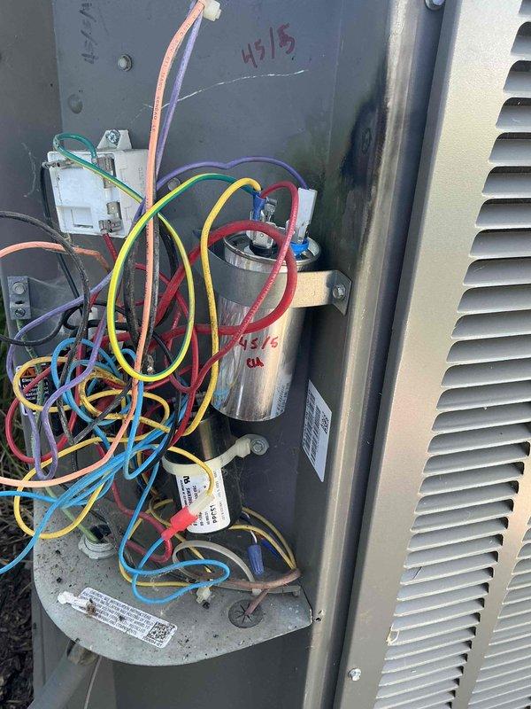 Responded to no cooling complaint on 8-year-old air conditioning system. Upon arrival, confirmed system was running but not providing adequate cooling or dehumidification throughout the home. Accessed outdoor condenser unit and performed electrical diagnostics using clamp meter to check amperage draw and component operation. Inspected control board wiring, connections, and dual-run capacitor. Testing revealed failed capacitor preventing compressor from operating properly. Replaced defective capacitor with new unit, verified proper electrical connections, and tested system operation. Confirmed compressor startup, normal amperage draw, and proper cooling cycle restoration. System returned to normal operation with adequate cooling capacity.