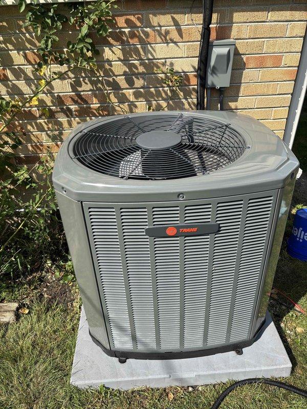 Performed comprehensive BFMA tune-up on an 11-month-old Trane air conditioning system. Completed full system inspection including condenser unit evaluation, verified electrical connections at disconnect box, checked refrigerant levels, inspected condenser coils and fan operation, and confirmed proper airflow through louvers. Unit operating within manufacturer specifications with all components functioning properly and no issues identified during preventive maintenance service.