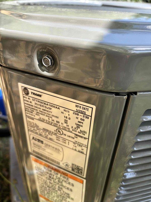 Performed comprehensive BFMA tune-up on an 11-month-old Trane air conditioning system. Completed full system inspection including condenser unit evaluation, verified electrical connections at disconnect box, checked refrigerant levels, inspected condenser coils and fan operation, and confirmed proper airflow through louvers. Unit operating within manufacturer specifications with all components functioning properly and no issues identified during preventive maintenance service.