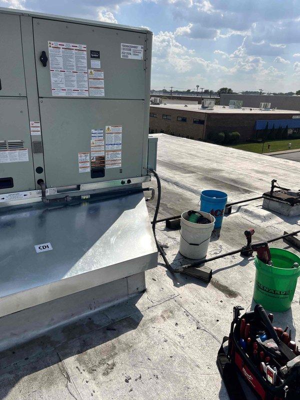 Completed full replacement of two commercial rooftop units on a commercial building. RTU1, a 30-year-old unit operating on discontinued refrigerant, and RTU2, a 20-year-old unit requiring extensive repairs, were removed and replaced with new equipment. Crane services were utilized on the west side of the building to safely lift and position the new units onto the rooftop, with all equipment suppliers and scrap removal services coordinated for efficient project completion.