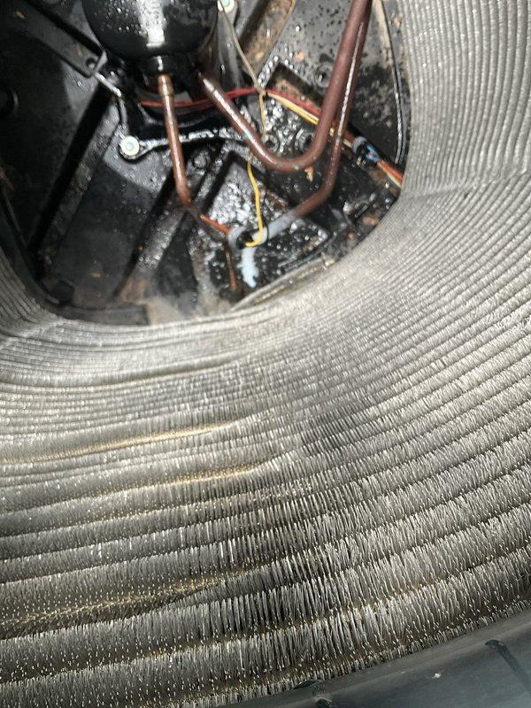 Responded to no-cooling call on 10-year-old residential AC system with non-operational outdoor condenser unit. Upon arrival, confirmed indoor air handler and blower motor functioning normally while outdoor unit remained inoperative. Performed comprehensive system diagnostics including electrical testing at disconnect, contactor evaluation, and capacitor analysis. Inspected evaporator coil assembly and refrigerant line connections, noting age-appropriate oxidation on copper piping but no active refrigerant leaks detected. Tested compressor windings and found open circuit indicating compressor failure. Measured system pressures and confirmed insufficient refrigerant circulation due to failed compressor. Checked condensate drain pan for proper drainage and verified no secondary issues with indoor components. Reviewed system age and repair history with homeowner, discussing compressor replacement versus full outdoor unit replacement options given the system's decade of service. Provided de