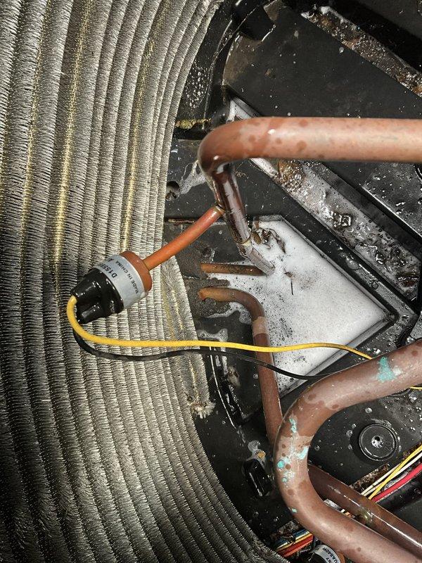 Responded to no-cooling call on 10-year-old residential AC system with non-operational outdoor condenser unit. Upon arrival, confirmed indoor air handler and blower motor functioning normally while outdoor unit remained inoperative. Performed comprehensive system diagnostics including electrical testing at disconnect, contactor evaluation, and capacitor analysis. Inspected evaporator coil assembly and refrigerant line connections, noting age-appropriate oxidation on copper piping but no active refrigerant leaks detected. Tested compressor windings and found open circuit indicating compressor failure. Measured system pressures and confirmed insufficient refrigerant circulation due to failed compressor. Checked condensate drain pan for proper drainage and verified no secondary issues with indoor components. Reviewed system age and repair history with homeowner, discussing compressor replacement versus full outdoor unit replacement options given the system's decade of service. Provided de