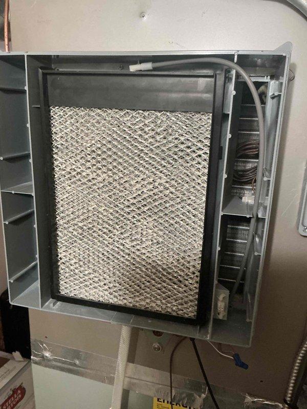 Completed comprehensive BFMA tune-up service on 6+ year old furnace system including full inspection, cleaning, and performance testing of all components. Replaced heavily soiled #201 air filter that showed significant dust accumulation and media compression with new filter to restore proper airflow and system efficiency. Serviced humidifier unit, verified all mechanical components, blower assembly, and ductwork connections for optimal operation heading into heating season.