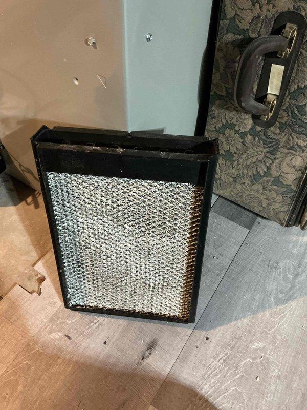 Performed comprehensive maintenance tune-up on 4-year-old furnace and air conditioning system. Inspected and cleaned air filter, which showed moderate dust accumulation along edges, and checked all mechanical components including ductwork, electrical connections, and hardware fasteners. All systems operational with no issues identified; equipment running within normal parameters.