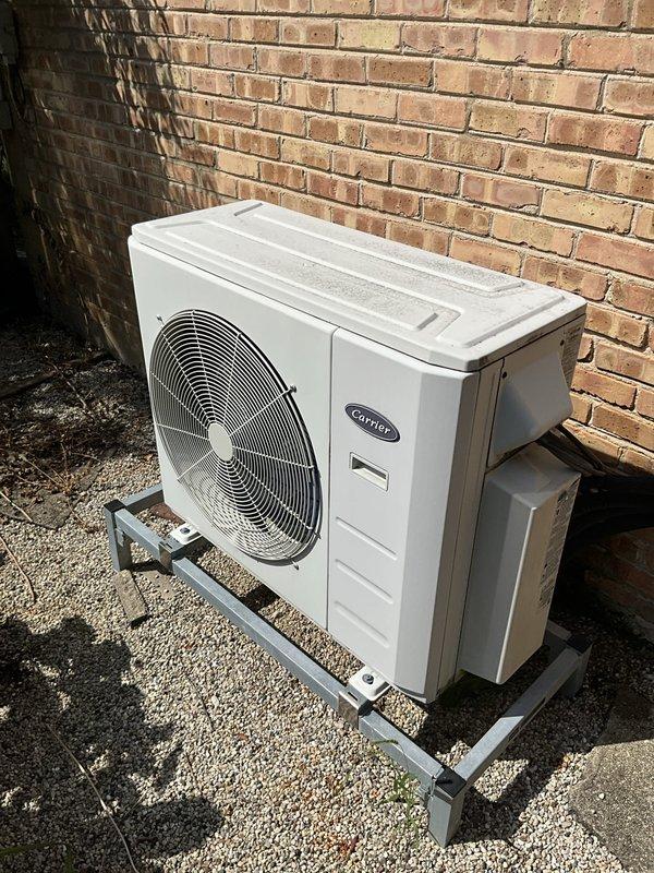Responded to service call for leaking mini split system. Inspected Carrier outdoor condenser unit and indoor air handler installation. Found condensate drainage issue causing water leakage from indoor unit. Installed Sauermann SI-30 condensate removal pump with wall-mounted bracket to address inadequate gravity drainage. Connected discharge tubing and verified proper pump operation and automatic cycling. Tested system under normal operating conditions to confirm leak resolution and proper condensate removal.