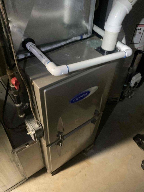 Completed fall HVAC tune-up on Carrier furnace system and diagnosed water leak issue at outdoor AC unit. Inspected and tested all heating components, replaced failed hot surface igniter, verified proper condensate drainage through PVC piping system, and confirmed unit operational. Addressed reported water leak from air conditioner, checked refrigerant levels, and ensured all systems functioning properly for upcoming heating season.