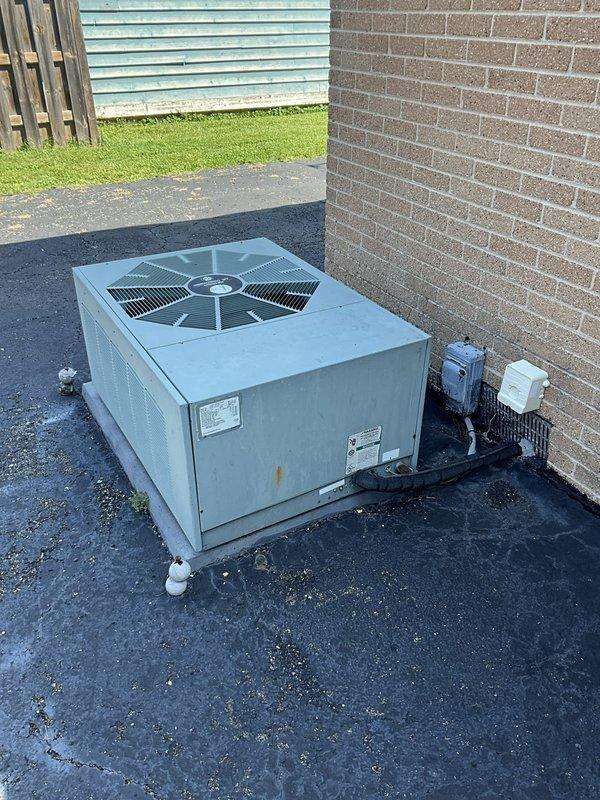Responded to no cooling complaint on 27-year-old residential air conditioning system. Upon arrival, inspected package unit located on exterior pad and verified unit was not producing cool air from supply vents. Performed diagnostic evaluation of aged HVAC equipment including visual inspection of outdoor unit components, electrical connections, and refrigerant system. Due to advanced age of equipment and lack of cooling output, identified system limitations and discussed findings with homeowner regarding unit condition and available options for restoration of cooling capacity.