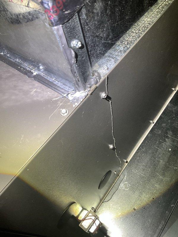 Responded to water leak from residential HVAC unit. Upon inspection, found significant standing water accumulated in the condensate drain pan with visible moisture on surrounding components and glass panel. System was still providing cooling but showed signs of potential drainage obstruction or freeze-up condition. Instructed occupant to turn off air conditioning and run fan only to prevent ice formation until follow-up service appointment could be completed for further diagnosis and repair of drainage system.