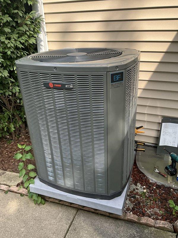 Responded to service call for air conditioning system not maintaining desired temperature. Customer reported thermostat set to 68°F but indoor temperature reading 75°F. Performed diagnostic evaluation of Trane outdoor condensing unit and electrical components. Inspected capacitor, contactor (model DY67B27P02), and associated wiring connections. Verified all electrical connections secure with proper wire routing and management. Examined outdoor unit placement on concrete pad, confirmed adequate clearance and airflow around condenser. System evaluated for proper operation of compressor and fan motor circuits.