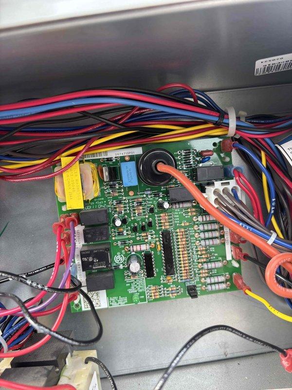 Responded to no cooling call on commercial rooftop unit and diagnosed failed main control circuit board. Replaced defective control board with new unit, reconnected all wire harnesses including power, control, and sensor wiring, and verified proper system operation. Unit restored to full cooling capacity.