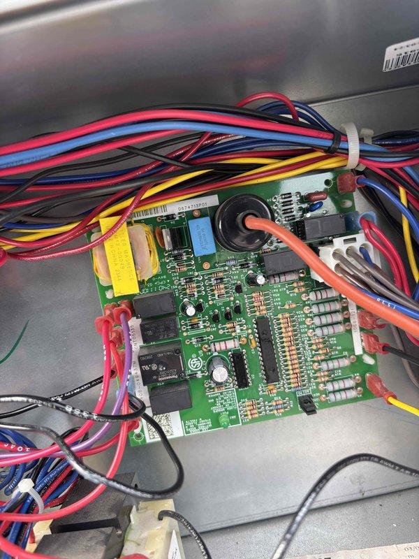 Responded to no cooling call on commercial rooftop unit and diagnosed failed main control circuit board. Replaced defective control board with new unit, reconnected all wire harnesses including power, control, and sensor wiring, and verified proper system operation. Unit restored to full cooling capacity.