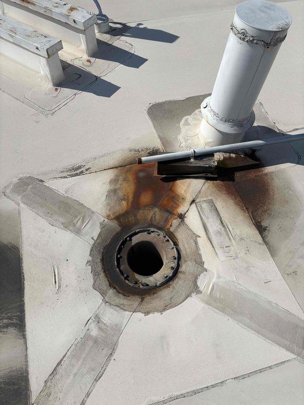 Completed scheduled BFMA preventive maintenance on commercial rooftop unit, performing comprehensive tune-up service that included replacement of nine filters across the RTU system. Documented existing rooftop conditions including rust staining around roof penetrations and general equipment positioning during routine filter change service.