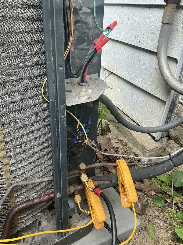Responded to service call for outdoor condensing unit requiring high pressure switch replacement. Upon arrival, connected manifold gauge set to service ports to diagnose system pressures and confirm high pressure switch failure. Verified part availability staged at headquarters and proceeded with replacement. Successfully removed faulty high pressure switch and installed new component per manufacturer specifications. Performed refrigerant charge verification using calibrated electronic scale, measuring 10.68 pounds to ensure proper system charge levels. Tested all electrical connections and confirmed proper system operation with new high pressure switch functioning correctly. Unit restored to normal operating condition with appropriate pressures achieved throughout system.