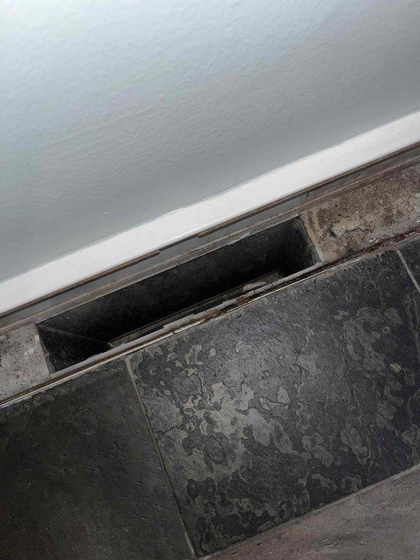 Completed comprehensive duct cleaning service for residential HVAC system. Cleaned all accessible ductwork, main trunk lines, and return air vents throughout the home, removing accumulated dust, debris, and contaminants from the system. Documented pre-service conditions showing significant dust buildup on floor-level return register and verified proper system operation upon completion.