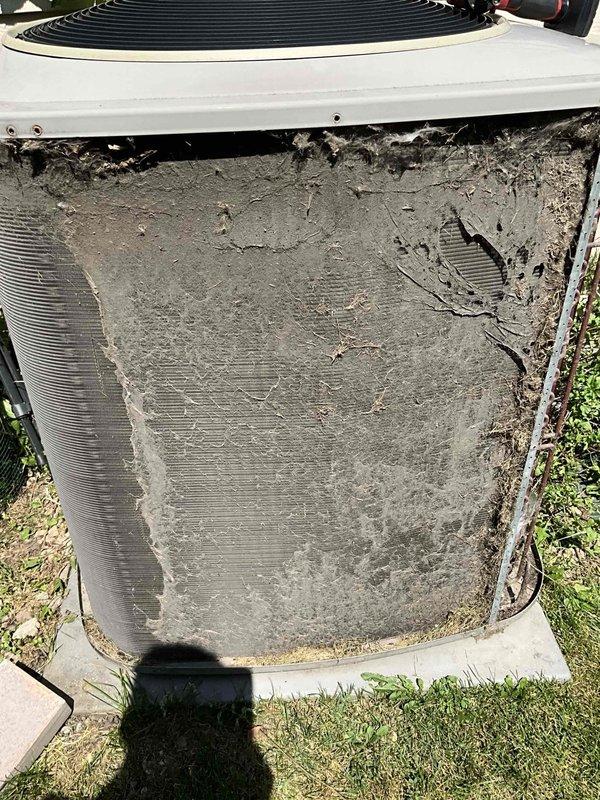 Completed comprehensive BFMA tune-up service on a 20+ year old air conditioning system. The outdoor condenser unit exhibited severe dirt and debris accumulation on the aluminum cooling fins, which was thoroughly cleaned to restore proper airflow and heat transfer efficiency. All system components were inspected, tested, and confirmed operational despite the age of the equipment.