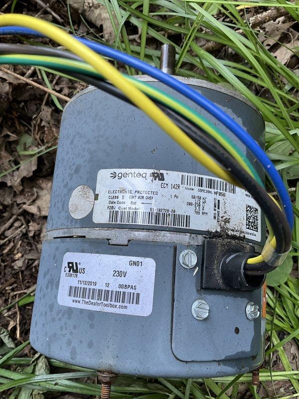 Responded to no cooling complaint on four-month-old residential air conditioning system under warranty. Upon inspection, discovered failed condenser fan motor preventing proper heat rejection from outdoor unit. Removed defective Genteq motor assembly and documented component failure with photographic evidence for warranty claim processing. Replaced motor, verified proper electrical connections at capacitor and control board, and restored system to normal cooling operation.