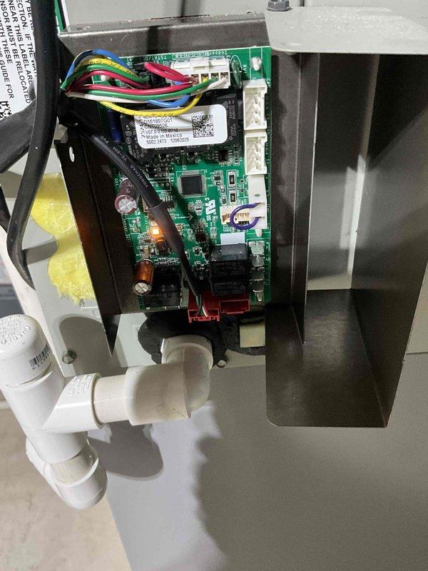 Responded to service call for air conditioning system experiencing operational issues despite recent tune-up in July. Performed diagnostic inspection of Trane outdoor condensing unit and internal control systems. Examined control board circuitry, wiring connections, and electrical components for proper operation. Inspected condensate drainage system including PVC piping and verified unit's overall mechanical condition.
