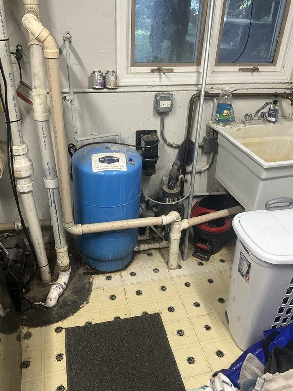 Conducted on-site consultation and assessment of existing water pressure system and expansion tank installation. Evaluated current blue pressure tank setup in utility room, inspected associated PVC plumbing connections, and reviewed exterior water service components including pressure gauge at outdoor spigot. Provided customer with detailed explanation of expansion tank functionality, sizing requirements, and installation options for proper thermal expansion protection in the domestic water system.