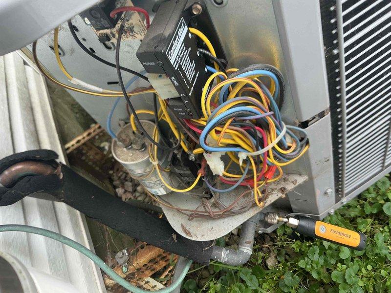Responded to after hours service call for HVAC system malfunction. Upon inspection, found blower wheel assembly with moderate dust and debris accumulation affecting airflow efficiency. Examined outdoor condensing unit and identified disorganized wiring connections at control board with multiple loose wire terminations. Cleaned blower wheel assembly, secured all electrical connections, and verified proper system operation before departure.