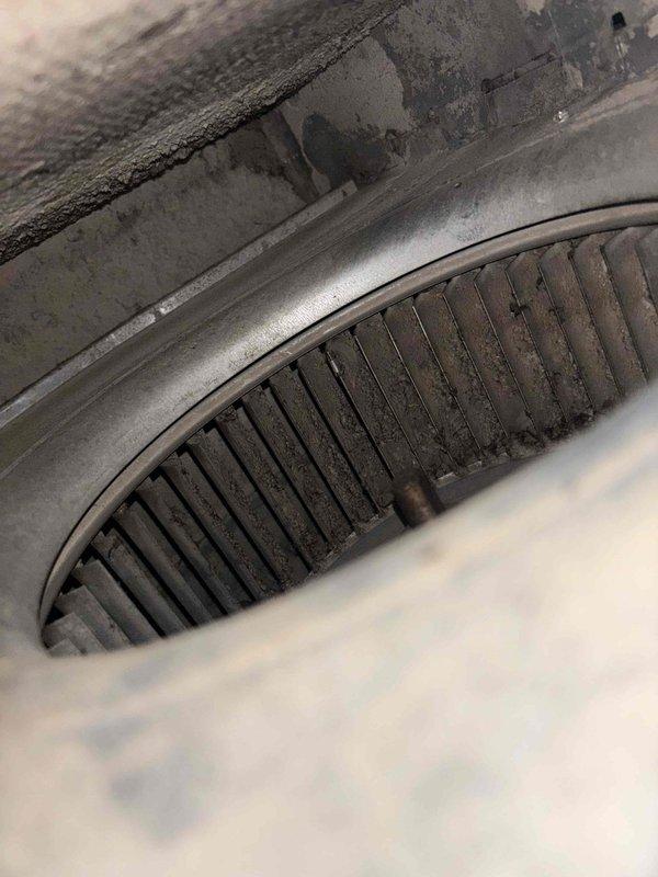 Responded to no cooling complaint on 10-year-old residential air conditioning system. Upon inspection, found severely restricted airflow due to heavily clogged 16x24x1 air filter and excessive dust accumulation on blower wheel assembly. Replaced dirty filter with new unit and cleaned blower wheel and surrounding ductwork to restore proper airflow. System tested and confirmed operational with adequate cooling output restored to all areas of residence.