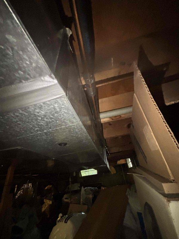 Returned to residential property to complete dye search investigation that was initiated on previous service visit. Thoroughly inspected HVAC system components including ductwork in interior spaces and exterior mechanical connections for fluorescent dye traces indicating refrigerant leak locations. Documented findings with photographic evidence showing brass fittings, piping connections, and system components for leak verification and future reference.