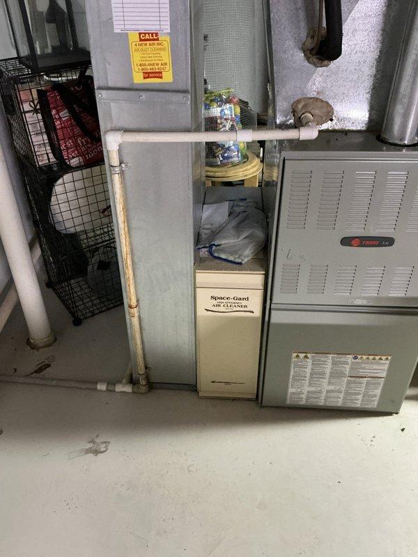 Conducted comprehensive sales estimate for complete HVAC system replacement of 20+ year old Trane furnace and Space-Gard air handler unit located in basement mechanical room. Documented existing equipment condition, electrical panel configuration with main breaker service, and overall system infrastructure including ductwork, PVC condensate piping, and associated components to provide accurate replacement recommendations for aged residential heating and cooling system.