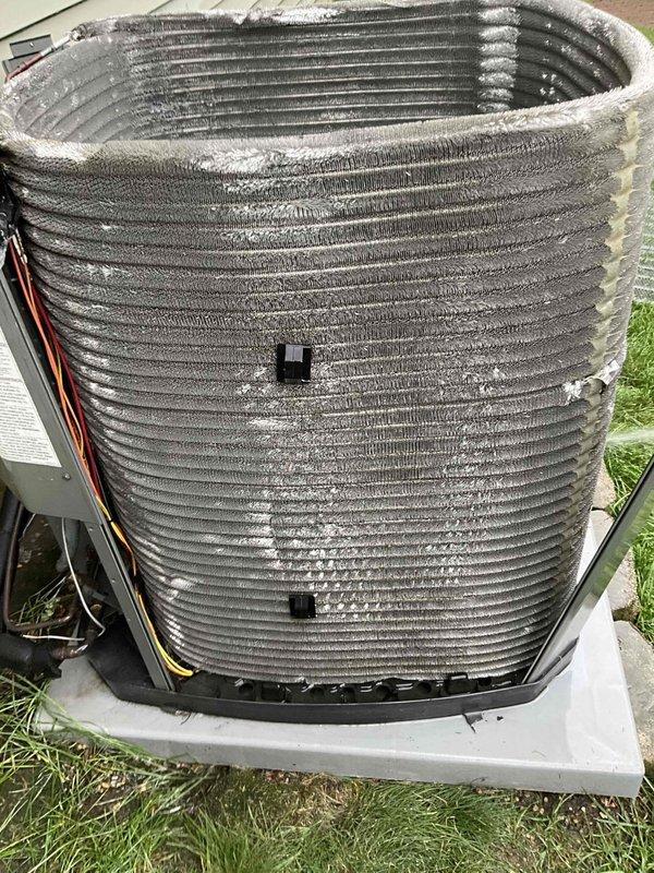 Completed comprehensive BFMA tune-up service including both air conditioning and furnace inspection on 4-year-old equipment. Inspected blower motor assembly, ductwork connections, and electrical wiring for proper operation. Identified significant frost accumulation on outdoor condenser coil fins, indicating potential refrigerant issue or restricted airflow requiring further diagnosis and correction to restore proper system function.