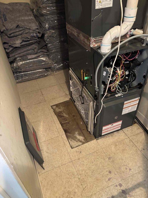 Responded to no cooling call with unit freezing over. Upon arrival, located furnace and air handler in interior utility closet rather than roof as initially suspected. Inspected system and found evaporator coil icing condition indicating restricted airflow or refrigerant issue. Documented equipment configuration and conditions with photos for diagnostic reference. Customer advised of findings and collected payment at time of service as requested.
