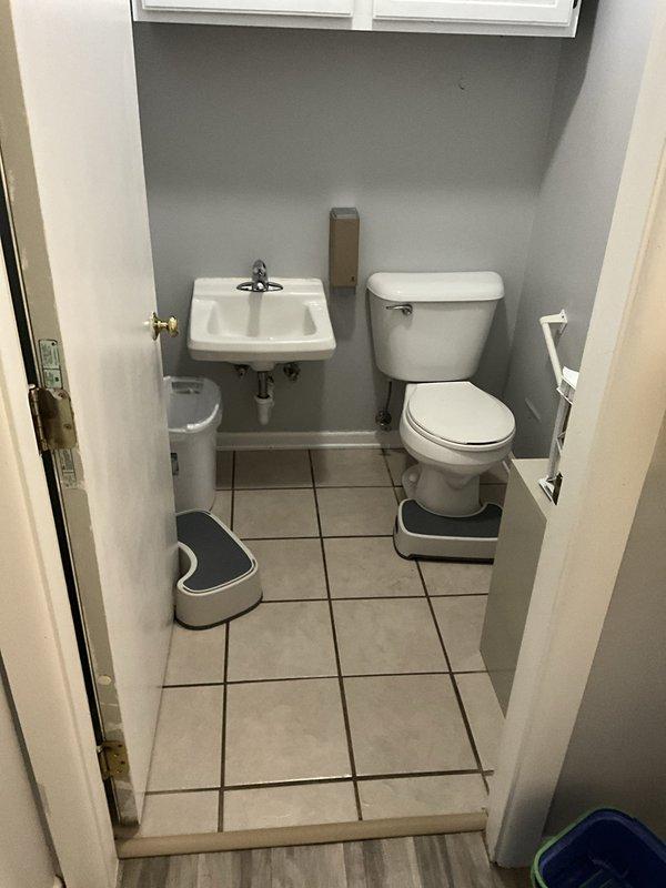 Responded to service call for non-flushing toilet in commercial bathroom. Upon arrival, inspected standard white porcelain toilet and confirmed flushing mechanism was not operating properly. Diagnosed blockage in drain line, performed augering procedure to clear obstruction, and restored proper flushing function. Tested toilet multiple times to verify complete resolution and left facility in clean, operational condition.