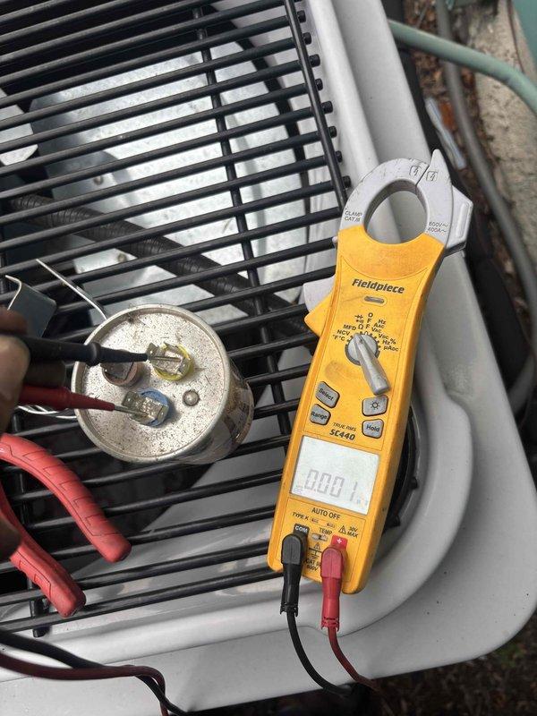 Responded to no cooling call where thermostat was set to 72°F but reading 79°F. Upon inspection, found failed capacitor on outdoor condensing unit. Tested capacitor with clamp meter confirming zero capacitance reading. Replaced defective capacitor with new unit, verified proper electrical connections, and tested system operation. Unit now cooling properly and maintaining setpoint temperature.