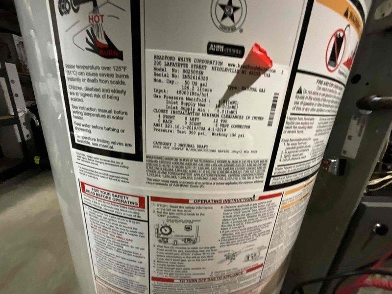 Completed comprehensive BFMA tune-up on residential furnace system, age 6+ years. Performed standard maintenance protocol including combustion analysis with carbon monoxide testing, confirming safe operation at 0.0 ppm with no detectable CO present. Inspected Bradford White water heater model RG250T6N (40,000 BTU/H natural gas) during system evaluation, verified proper labeling and safety information posted on equipment.
