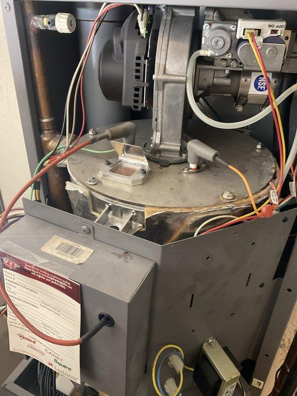 Completed annual boiler maintenance including inspection of combustion chamber assembly, blower motor, gas valve controls, and all electrical connections. Verified proper operation of ignition system, heat exchanger, digital control board, and all safety devices. Cleaned and tested unit, confirmed all copper piping connections and brass valves secure with no leaks detected.