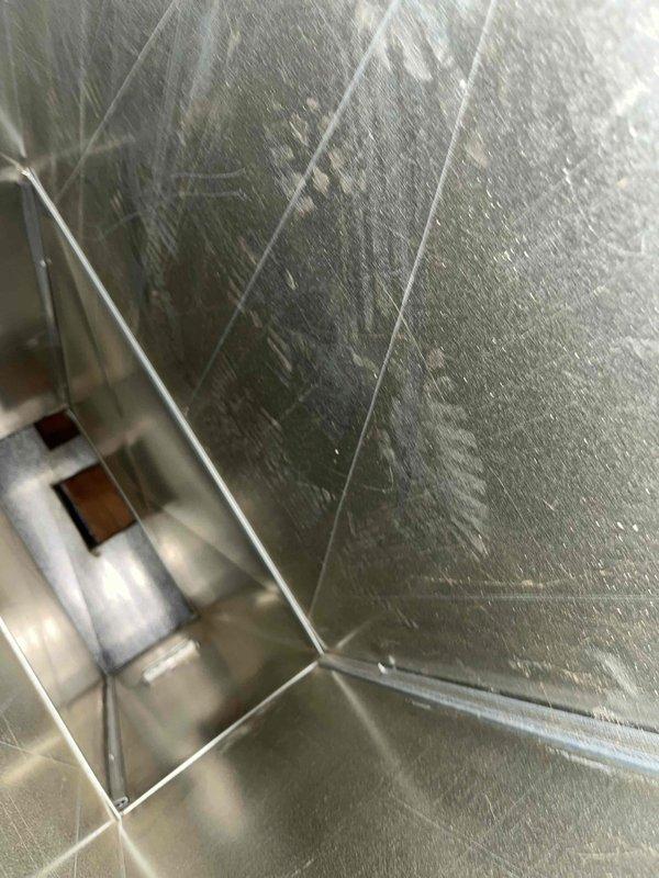 Performed comprehensive duct cleaning service for residential HVAC system. Accessed and cleaned interior metal ductwork, removing accumulated dust and debris from galvanized steel rectangular ducts throughout the system. Inspected duct integrity, connections, and access ports to ensure proper system operation. Cleaned and serviced basement mechanical room equipment including heating/cooling units and associated ductwork infrastructure, verifying all components are functioning properly and maintaining adequate airflow throughout the home.