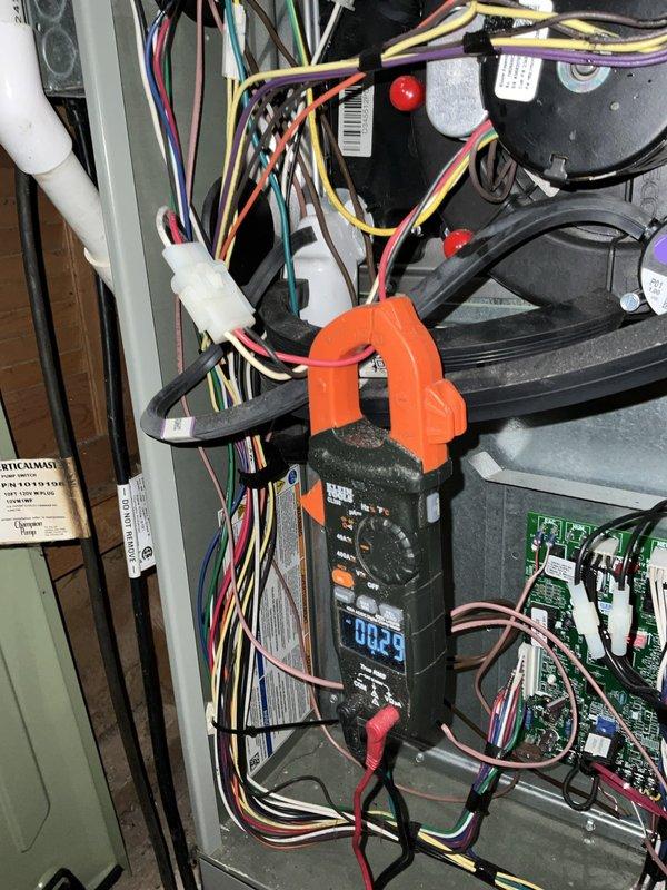 Completed comprehensive BFMA tune-up on 5+ year old furnace system including humidifier and filter service. Performed electrical diagnostics with amp meter showing 0.25A draw, inspected all wire connections and control board operation, and examined blower motor assembly for proper function. Verified refrigerant line connections, service port accessibility, and insulation integrity on copper lines throughout the system.