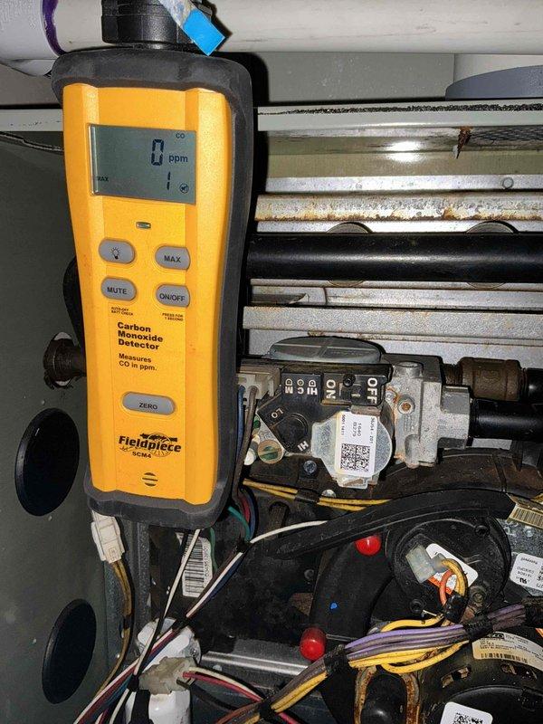 Completed comprehensive BFMA tune-up service including furnace maintenance and humidifier inspection. Performed carbon monoxide safety testing at the heat exchanger with results showing 0 ppm, confirming safe operation and proper combustion. Inspected temperature sensor, electrical connections, condensate system, and all mechanical components to ensure optimal system performance for the heating season.