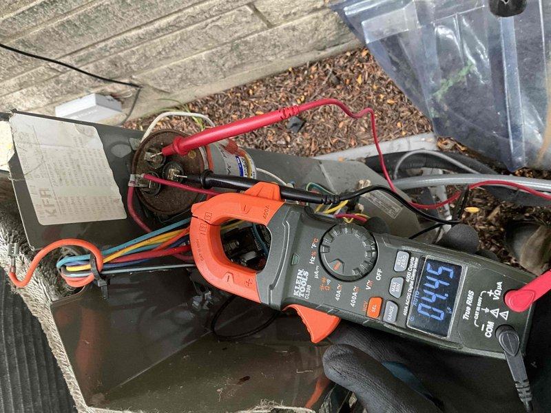 Completed comprehensive BFMA tune-up service on residential air conditioning system, performing electrical diagnostics with amp draw readings of 57.9 amps and voltage testing on outdoor unit. The condenser coil exhibited heavy accumulation of dust, debris, lint, and fibrous material throughout the fin assembly, which was addressed during the maintenance service to restore proper airflow and system efficiency.
