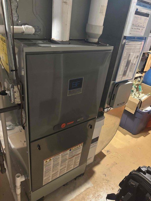 Completed fall preventative maintenance and tune-up on a four-year-old Trane furnace located in basement. Performed comprehensive system inspection, cleaning, and operational testing using calibrated digital multimeter to verify electrical components and safety controls. All systems operating within manufacturer specifications with no issues found.