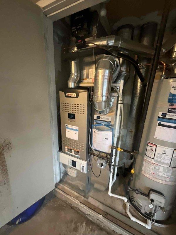 Completed comprehensive BFMA tune-up service on residential furnace and humidifier system located in utility closet. Performed full furnace inspection including burner assembly, heat exchanger, blower motor, and gas connections; verified proper operation and safety controls. Serviced humidifier unit with #10 pad replacement, checked water supply line, and confirmed proper humidity output and drainage function.