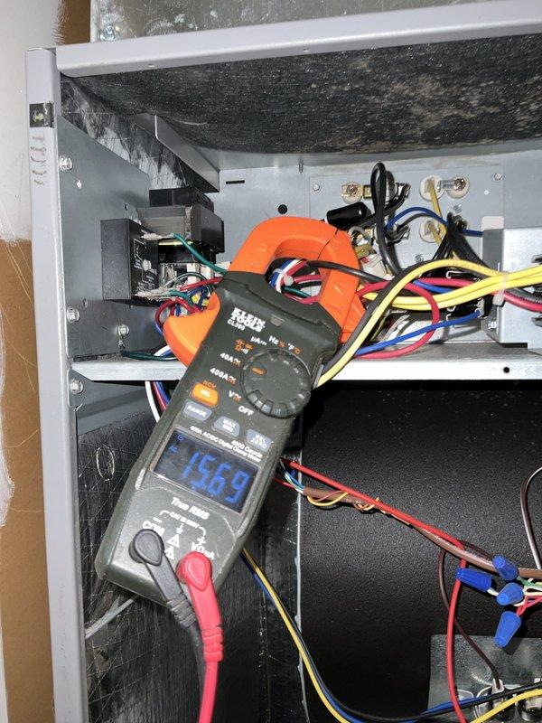 Completed comprehensive BFMA tune-up service on a 3-ton, 2-year-old split HVAC system including air conditioning unit and air handler. Performed electrical diagnostics using digital multimeter, recording voltage reading of 1369 millivolts at control panel, inspected all electrical connections, contactors, and wiring throughout the system. Cleaned and serviced air handler unit located in utility closet, inspected refrigerant lines, condensate drainage system, and all mechanical components to ensure proper operation and system efficiency.