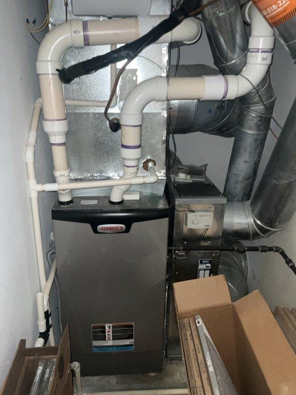 Completed comprehensive BFMA furnace tune-up on 8-year-old Lennox heating system. Performed full system inspection, replaced dirty 20x25x1 air filter, tested all electrical components and control board functionality, verified proper operation of blower motor assembly, inspected condensate drainage and PVC venting system for proper drainage and secure connections, and confirmed safe furnace operation. System is operating within manufacturer specifications and ready for heating season.