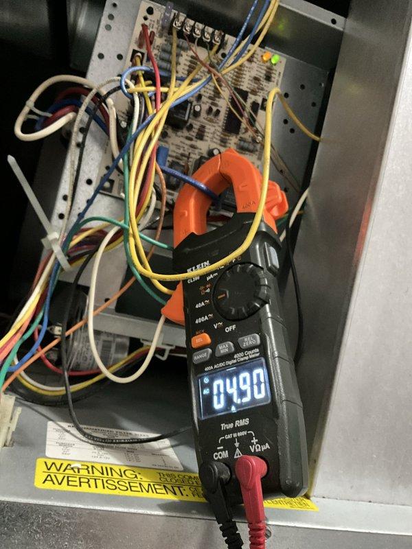 Performed comprehensive furnace tune-up and maintenance inspection. Conducted visual examination of heat exchanger assembly, confirming proper structural integrity of serpentine coil configuration with no visible cracks or deterioration. Performed electrical diagnostics using clamp meter to verify amperage draw and system performance, measuring 4.90 amps at control board. Inspected all electrical connections, wiring, and control components within junction panel for proper operation and safety compliance. System operating within normal parameters upon completion of tune-up service.