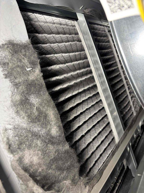 Completed comprehensive BFMA tune-up service including maintenance on two furnace systems and humidifier units. Performed standard safety testing including carbon monoxide detection with readings at 0 ppm, confirming safe combustion operation. Identified significant dust and lint accumulation on air filter housing and surrounding intake components, indicating need for improved filtration maintenance schedule.