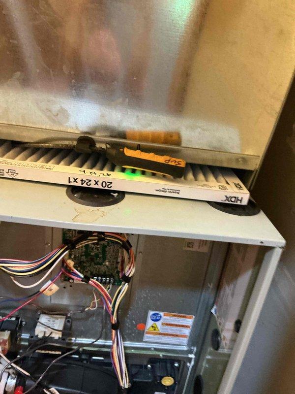 Completed comprehensive BFMA furnace tune-up on 6-year-old heating system. Performed full inspection of furnace components, verified thermostat operation at 73°F setpoint, inspected control board wiring and connections, checked filter size specifications (20x24x1), and documented system condition with photos. All components found operating within normal parameters with no immediate concerns noted.