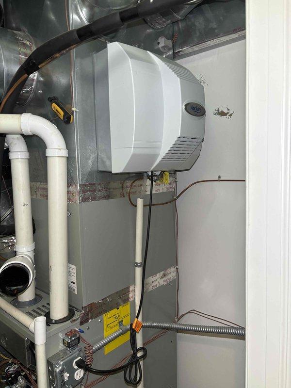 Completed comprehensive BFMA tune-up service on two furnace systems with two humidifiers at property as first appointment of the day. Both furnace units, aged 10+ years, were thoroughly inspected including burner assemblies, heat exchangers, ignition systems, and all safety controls. Cleaned burner ports, verified proper combustion, tested all electrical connections, and confirmed adequate airflow through ductwork. Performed humidifier maintenance service on both units, replacing #35 water panel pads, cleaning mineral deposits from distribution trays, inspecting water supply lines and solenoid valves, and verifying proper humidity output. Checked condensate drain lines for proper flow and cleared PVC piping. All systems tested and operating within manufacturer specifications upon completion.